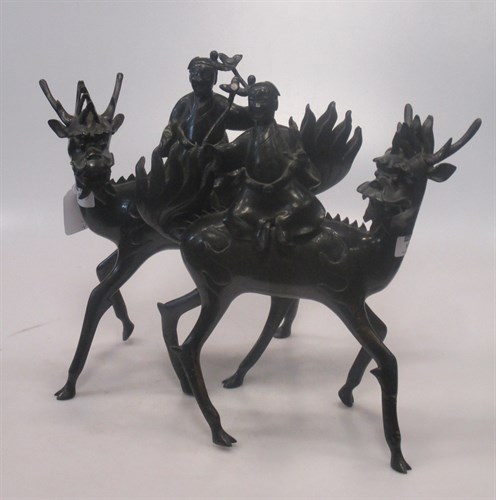Lot 68 - A pair of Chinese bronze figures, of men...