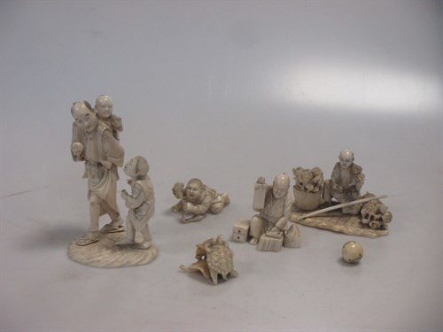 Lot 136 - Two Japanese carved Okimono figure groups...