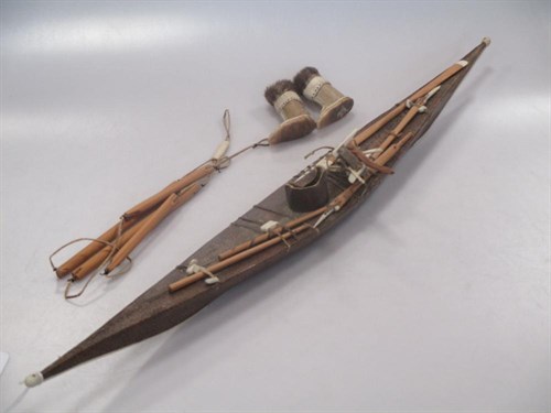 Lot 137 - A Canadian Inuit style wood model of a rigged...
