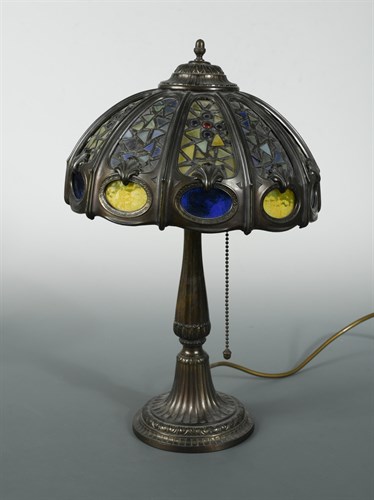Lot 84 - A bronzed table lamp in the manner of Tiffany