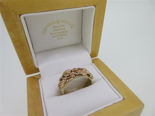 Lot 116 - Clogau - A 9ct rose and yellow gold 'Tree of Life' band ring