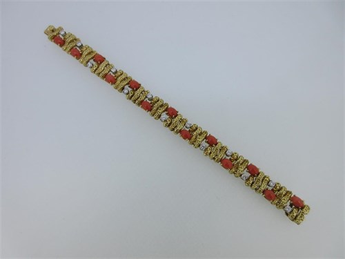 Lot 82 - A French diamond and red coral bracelet