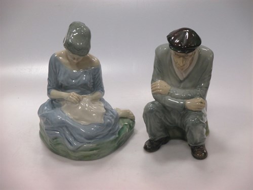 Lot 93 - An pair of Irish porcelain figures of a seated...