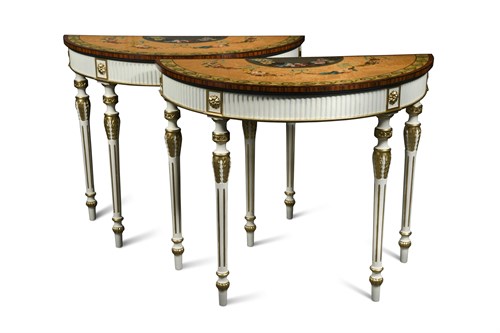 Lot 661 - A pair of Sheraton revival painted satinwood demi-lune tables