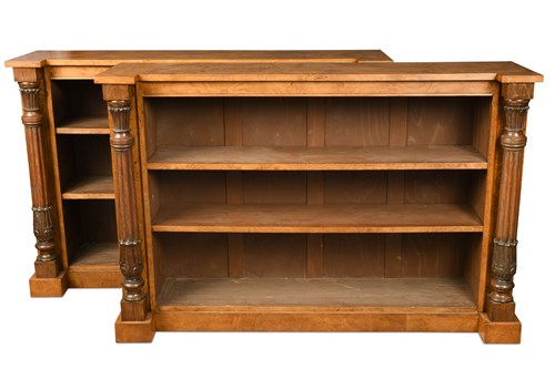 Lot 644 - A pair of William IV style figured oak open front bookcases