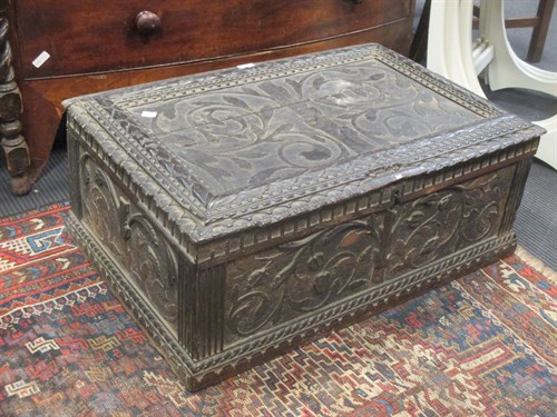 Lot 404 - A 17th century carved oak box