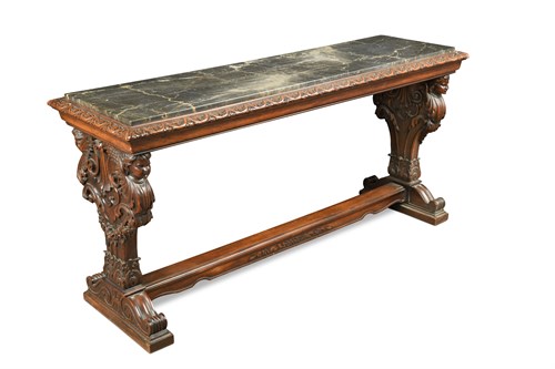 Lot 649 - A Continental carved walnut and marble top console table