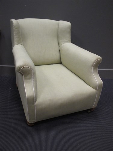 Lot 485 - An Edwardian wing-back lounging chair,...