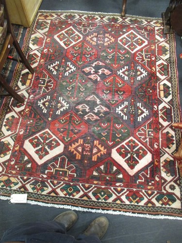 Lot 505 - A hand-knotted Bakhtiari rug with geometric...