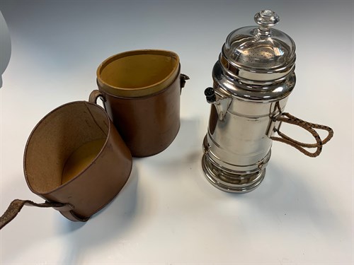 Lot 11 - A leather cased travelling kettle, 19.5cm high