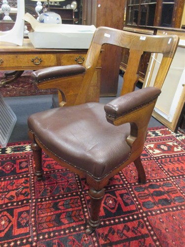 Lot 373 - A 20th century desk chair with padded arms and...