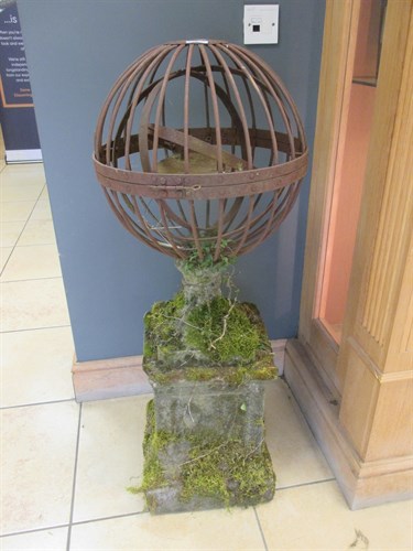 Lot 530 - A wrought iron garden sphere with twin candle...