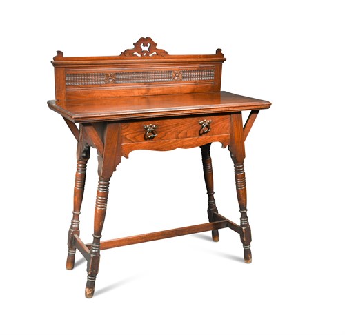 Lot 504 - An Arts and Crafts walnut side table, the...