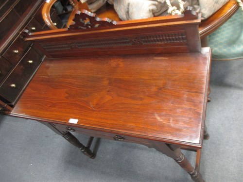 Lot 122 - An Arts and Crafts walnut side table, the...