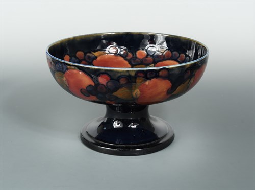 Lot 101 - A large Moorcroft Pomegranate pattern pedestal fruit bowl