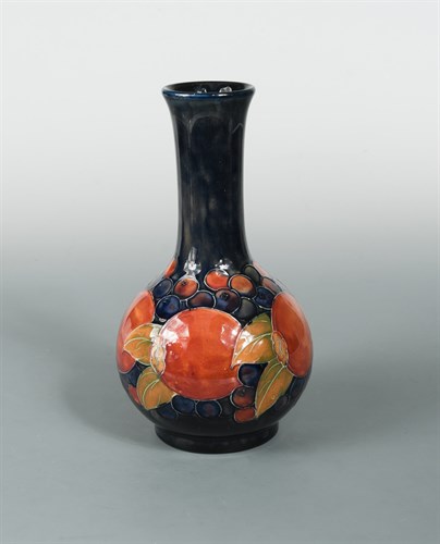 Lot 33 - A Moorcroft Pomegranate pattern bottle vase