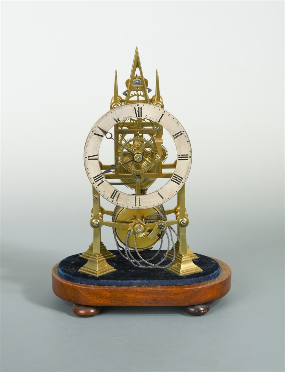 Lot 482 - A 19th century Gothic design brass skeleton timepiece
