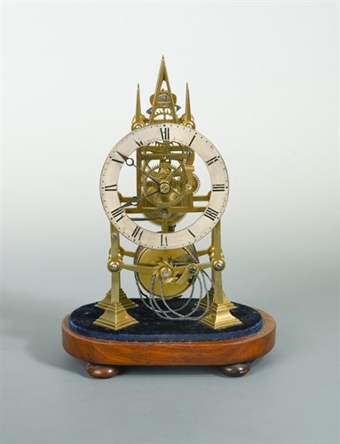 Lot 482 - A 19th century Gothic design brass skeleton timepiece