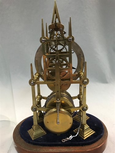 Lot 482 - A 19th century Gothic design brass skeleton timepiece