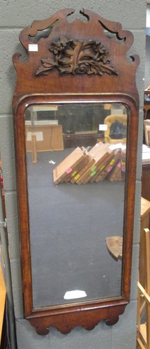 Lot 407 - A Georgian style fret carved walnut frame...