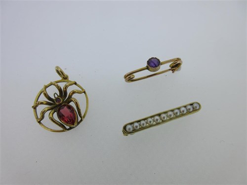 Lot 124 - A red spinel set spider pendant and two gem set cravat pins