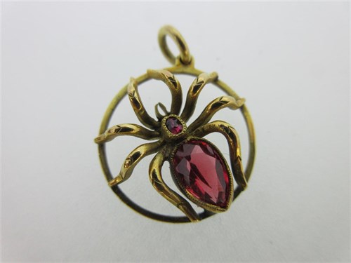 Lot 124 - A red spinel set spider pendant and two gem set cravat pins