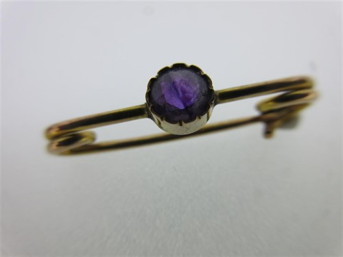 Lot 124 - A red spinel set spider pendant and two gem set cravat pins