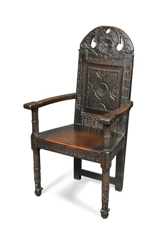 Lot 518 - A 17th century oak 'Cacqueteuse' wainscote armchair