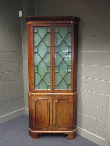 Lot 445 - A George III period mahogany corner cupboard...