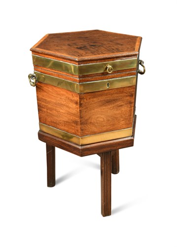 Lot 570 - A George III mahogany and brass bound octagonal wine cooler