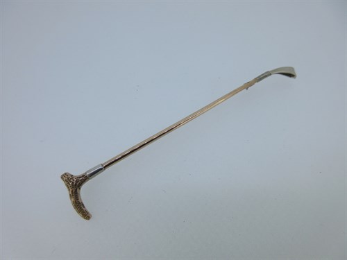 Lot 114 - A large stock pin in the shape of a riding crop