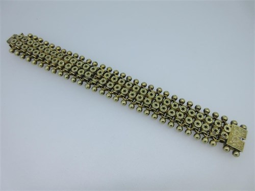 Lot 125 - A star and ball mesh link bracelet