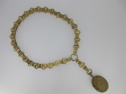 Lot 50 - A late 19th century bar and hoop link collar suspending a cast locket