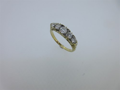 Lot 103 - An Edwardian five stone diamond ring