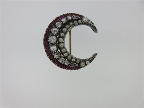 Lot 187 - A 19th century diamond, rubellite and seed pearl closed crescent brooch