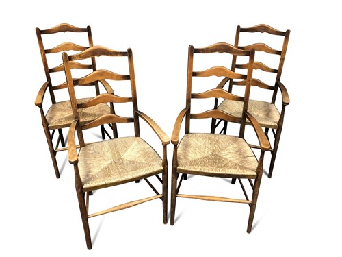 Lot 124 - A set of four Arts & Crafts ladder back armchairs
