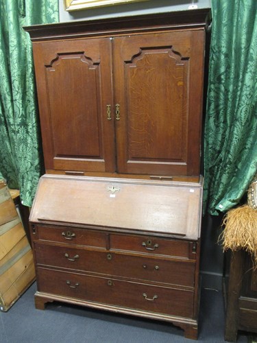 Lot 444 - A Georgian oak bureau/bookcase, the upper part...