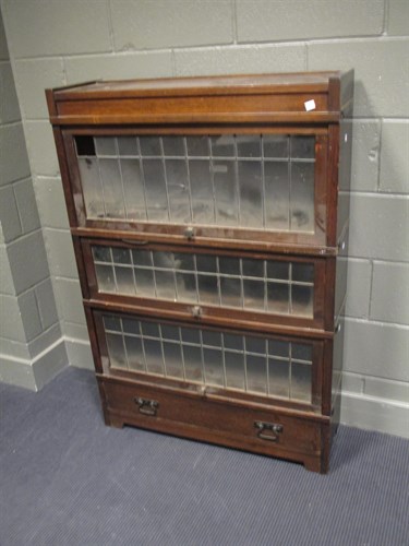 Lot 477 - An oak Globe Wernicke style bookcase enclosed...