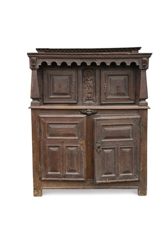 Lot 516 - A 17th century carved oak court cupboard