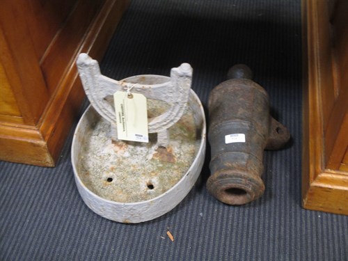Lot 514 - A cast iron boot scraper and a small cannon