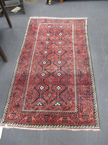 Lot 512 - A Beluchi rug 214 x 115 cm