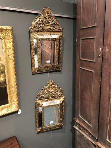 Lot 446 - A pair of Dutch gilt brass wall mirrors
