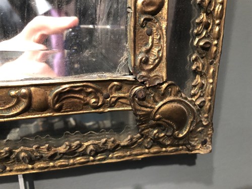 Lot 446 - A pair of Dutch gilt brass wall mirrors