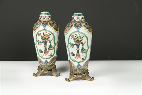 Lot 453 - A pair of 19th Century gilt metal mounted famille verte type vases and covers