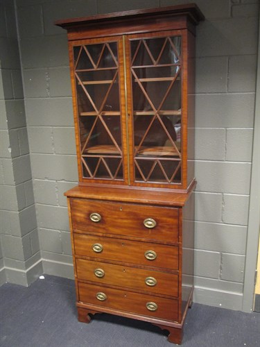 Lot 437 - A secretaire bookcase of small proportions...