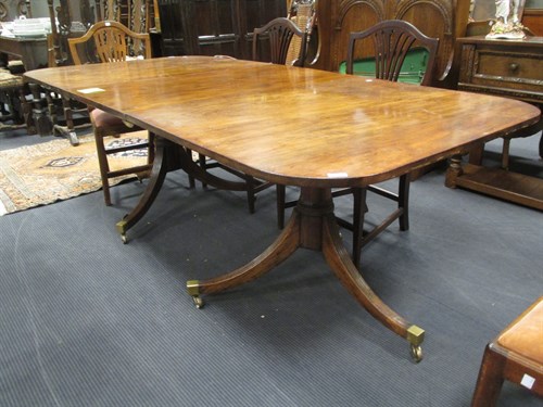Lot 474 - A small twin pedestal dining table with one...