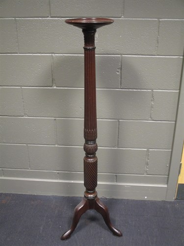 Lot 457 - A mahogany torchere
