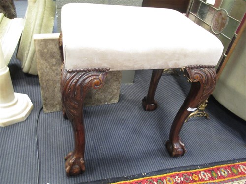 Lot 418 - A mahogany stool, suede covered seat, on claw...