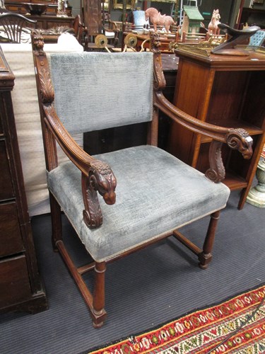 Lot 425 - A late 19th century walnut elbow chair with...