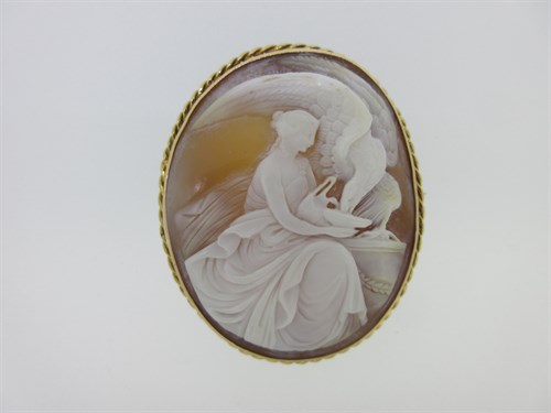 Lot 172 - A shell cameo brooch depicting Hebe feeding Jupiter's eagle